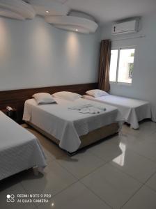 Ein Bett oder Betten in einem Zimmer der Unterkunft Hotel Serrano