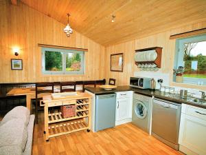 a kitchen with a sink and a stove top oven at The Goyle-e4528 in Uplowman