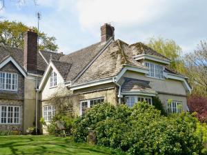 an old house with a roof and a yard at Valley View in Hawley Bottom