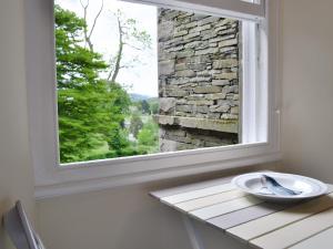 a window in a room with a bowl on a table at 4 The Old Vicarage in Far Sawrey