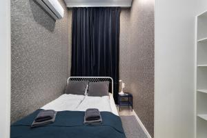 Posteľ alebo postele v izbe v ubytovaní Delta Apartments Budapest