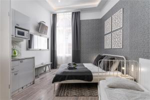 Posteľ alebo postele v izbe v ubytovaní Delta Apartments Budapest