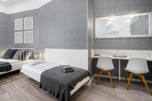 Posteľ alebo postele v izbe v ubytovaní Delta Apartments Budapest