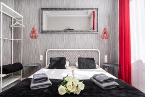 Posteľ alebo postele v izbe v ubytovaní Delta Apartments Budapest