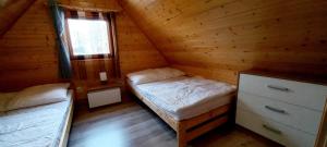 Łóżko lub łóżka w pokoju w obiekcie Ośrodek 9Amber