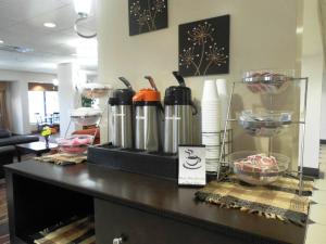 a counter in a office with a bunch of appliances at Motel 6-Pine Bluff, AR in Pine Bluff