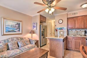 a living room with a couch and a kitchen at Oceanfront Corpus Christi Condo with Pool! in Corpus Christi