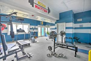 a gym with several tread machines in a room at Oceanfront Corpus Christi Condo with Pool! in Corpus Christi
