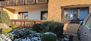 a house with a garden in front of it at HarzLiebe in Herzberg am Harz +8 photos