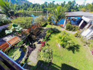 an aerial view of a garden with benches and plants at Pousada entre Paraísos in Angra dos Reis