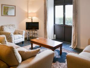 a living room with two couches and a coffee table at Tower House in Ambleside