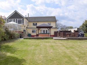 a house with a large yard in front of it at Green Haven in Narberth