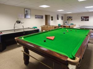 a pool table in a room with afits at The Olde Granary - E4298 in Halston
