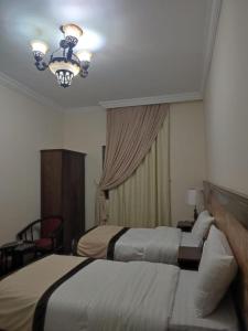 Uma cama ou camas num quarto em اوتاد المتحدة