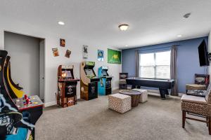 a childrens room with a game room with a pool table at Spacious 8 BDR Family Home with Arcades and Free Pool Heat in Orlando