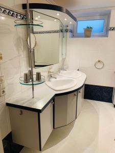a bathroom with a sink and a mirror at Bergurlaub Königsleiten in Königsleiten