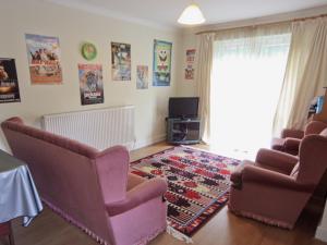 a living room with two chairs and a rug at Ty Gwyn - Hw7322 in Haverfordwest