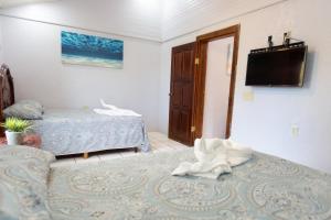 Voodi või voodid majutusasutuse Sea Eye Hotel - Sunset Building toas