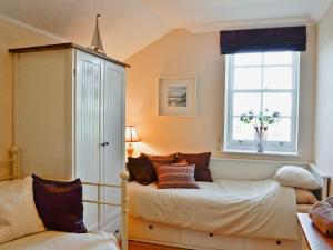 a bedroom with two beds and a window at Meadowsweet in Newburgh