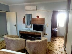 TV a/nebo společenská místnost v ubytování فاكانزا شقة فندقية مفروشة- vacanze