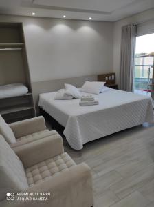 Ein Bett oder Betten in einem Zimmer der Unterkunft Hotel Serrano