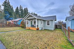 a blue house with a fence in the yard at Port Angeles Retreat - 1 Mi to Downtown! in Port Angeles