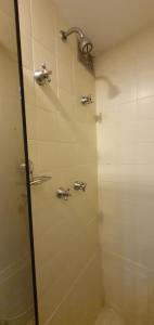 a shower with three faucets in a bathroom at Perfect views best location in Rio de Janeiro