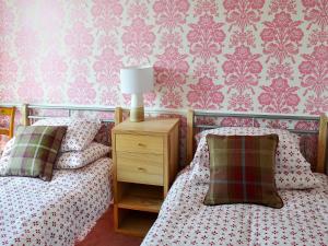 Ліжко або ліжка в номері Rose Cottage