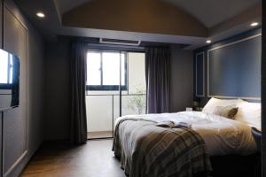 Postel nebo postele na pokoji v ubytování Giant Rich Hotel