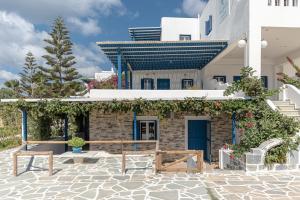 a building with a bench in front of it at Crystal Naxos 1 Studios at Mikri Vigla in Mikri Vigla