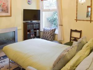 Postel nebo postele na pokoji v ubytování Dorothy's Cottage