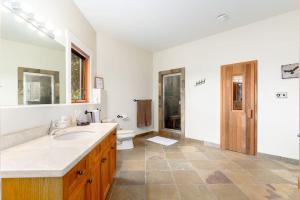 a bathroom with a sink and a toilet at Season Premiere Winery-Bed & Breakfast in vineyard in Abbotsford