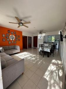 a living room with a couch and a table at Viento Casa los 4 elementos in Cancún