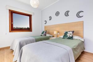 Postel nebo postele na pokoji v ubytování Sea Moon Lanzarote