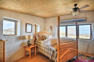 a bedroom with a bed and a ceiling fan at Unique Del Norte Getaway on 50 Private Acres! in Del Norte
