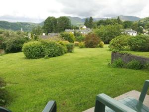 a view of a yard with a green lawn at Badgers Rake 7 in Ambleside