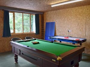 a billiard room with a pool table in it at Solitude in Aberhafesp