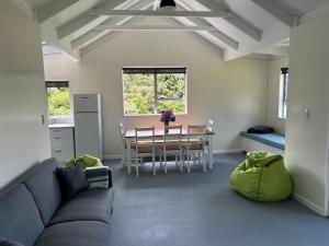 a living room with a couch and a table at Resolution Bay in Resolution Bay