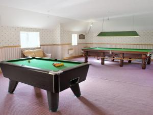 a billiard room with two pool tables in it at Hill House in Melbourne