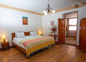 Postel nebo postele na pokoji v ubytování Centenario Inn