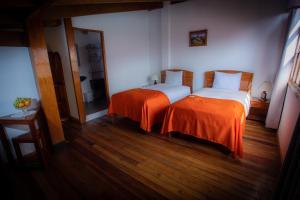 Postel nebo postele na pokoji v ubytování Centenario Inn