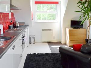 a kitchen with a sink and a counter top at Hillcroft in Cold Norton