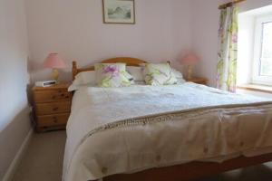 Llit o llits en una habitació de Garries Cottage