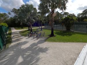 a group of bikes parked next to a tennis court at Naples Dream at WTC with Heated Pool SPA Sauna 7 bicycles and 3 mls to beach in Naples