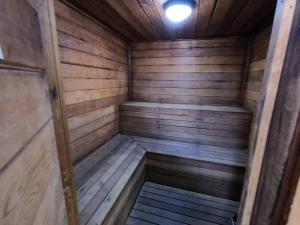 a wooden sauna with a light on the ceiling at Naples Dream at WTC with Heated Pool SPA Sauna 7 bicycles and 3 mls to beach in Naples