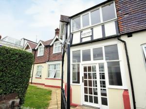 an external view of a house with a garage at Felix Court in Felixstowe