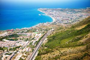 an aerial view of a city and the ocean at Duquesa Harbour Club Aparthotel in Manilva