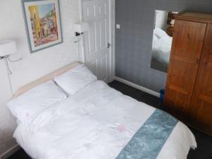 A bed or beds in a room at The Briar Rose