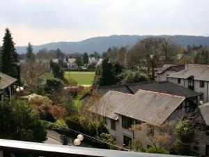 a view of a village with houses and trees at College Gate in Windermere