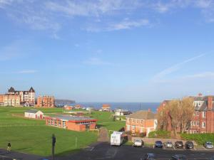 a view of a town with buildings and the ocean at Dawns Gem in Whitby